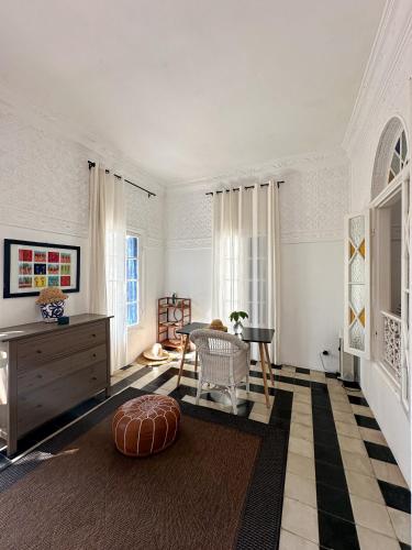 a living room with a table and a couch at Mar y Montana House in Tangier