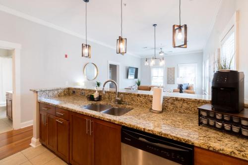 a kitchen with a sink and a counter top at Savannah Residences in Savannah