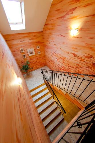 a spiral staircase in a room with wooden walls at Willa pod Czantorią SPA Ustroń in Ustroń