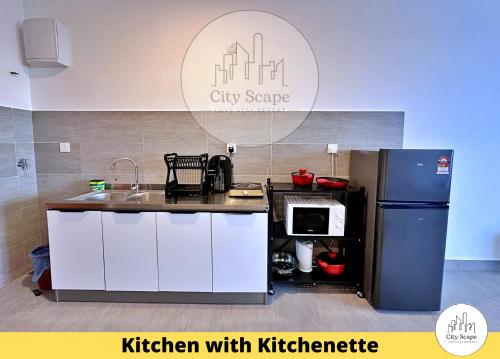 a kitchen with a refrigerator and a kitchen with kitzknife at Setia Alam Sunsuria Forum Soho Suites by Cityscape in Setia Alam