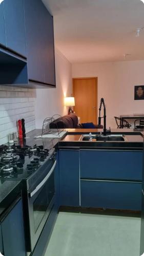 Dapur atau dapur kecil di Quarto em Apartamento