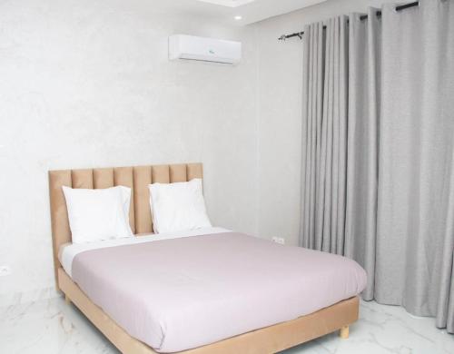 Ένα ή περισσότερα κρεβάτια σε δωμάτιο στο Résidence de la Renaissance