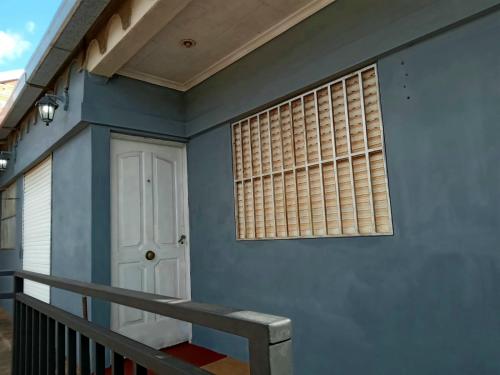 a house with a door and a window at RoMalandya in Villa Dolores