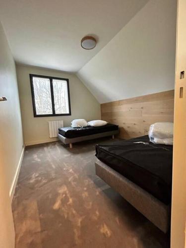 Ένα ή περισσότερα κρεβάτια σε δωμάτιο στο Chalet Picherande - Charreire