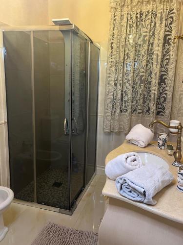 a bathroom with a shower and a sink at B & B Temptation Airport Fontanarossa shared house with several rooms in Catania