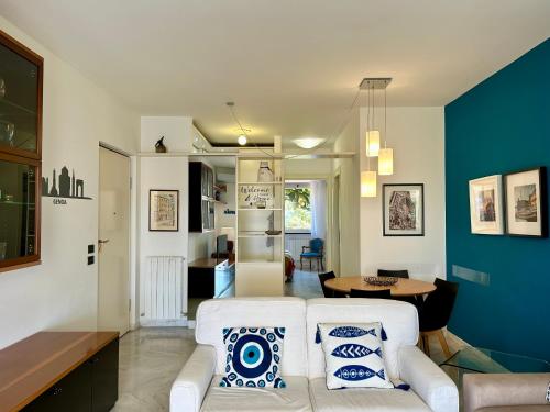 a living room with a couch and a table at IL LEUDO in Lavagna