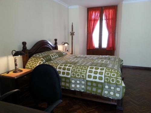 Кровать или кровати в номере Villa Oropeza Hostel