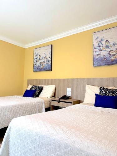 Cama o camas de una habitación en Hotel Andros