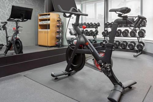 a gym with two exercise bikes in a room at Hilton Garden Inn Orlando International Drive North in Orlando
