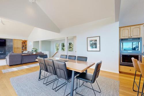 a kitchen and dining room with a table and chairs at Capeside Paradise in Pacific City