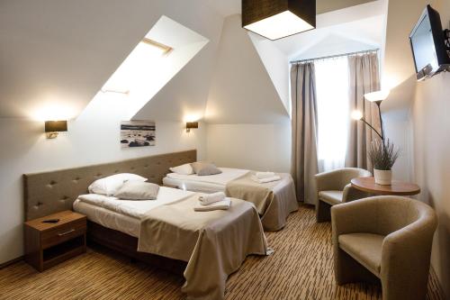 Voodi või voodid majutusasutuse Holiday Golden Resort & Spa toas