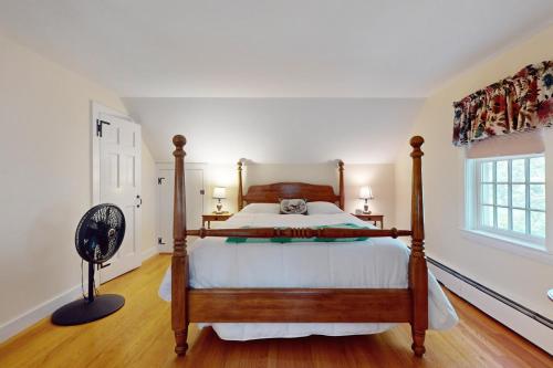 a bedroom with a large bed and a window at Cozy & Quiet Hyannis Retreat in Hyannis