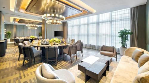 a dining room with a long table and chairs at Holiday Inn Shenzhen Nanshan by IHG in Shenzhen