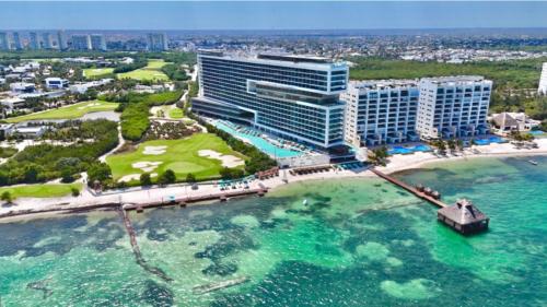 an aerial view of a resort and the ocean at Dreams Vista Cancun Golf & Spa Resort in Cancún