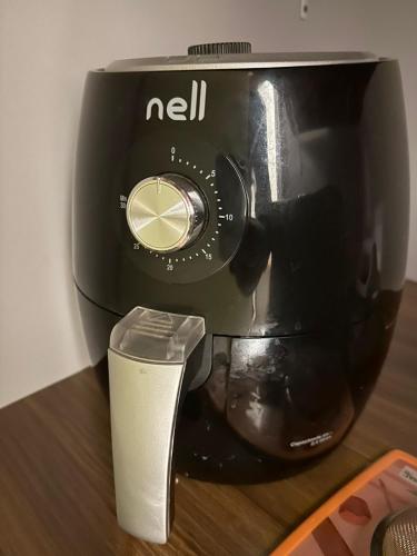 a black blender sitting on top of a table at Kitnet em Americana SP in Americana
