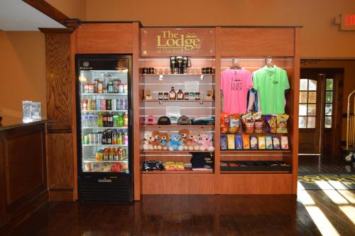 a store with a large refrigerator with clothes in it at The Lodge at Flat Rock in Upward