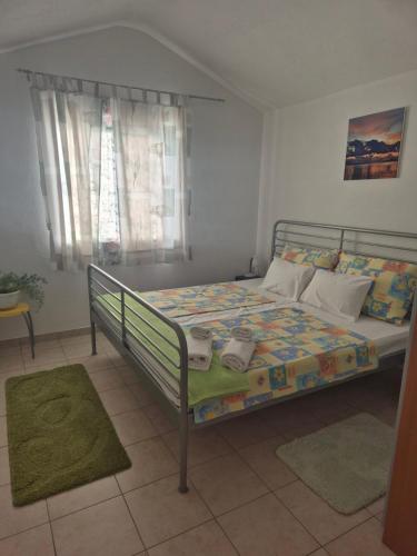 a bedroom with a bed in a room at A.M. in Orebić