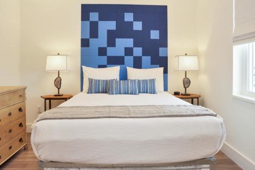 a bedroom with a large bed with two lamps at Rejuvenation by Pristine Properties Vacation Rentals in Saint Joe Beach