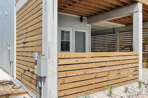 a wooden fence on the side of a house at Rejuvenation by Pristine Properties Vacation Rentals in Saint Joe Beach