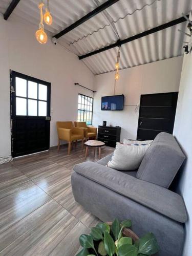 a living room with a couch and a table at Casa La Santamaria in Suesca