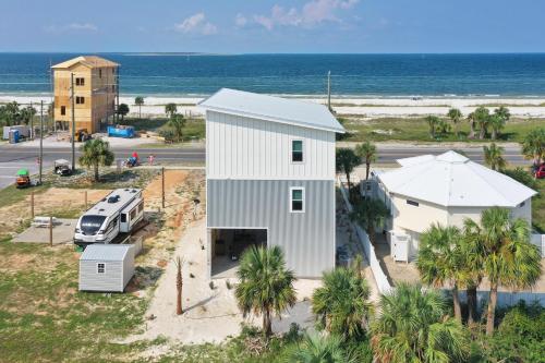 an aerial view of a white house and a van at Rejuvenation by Pristine Properties Vacation Rentals in Saint Joe Beach
