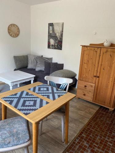 a living room with a couch and a table at Appartement Pension Feist in Dagebüll