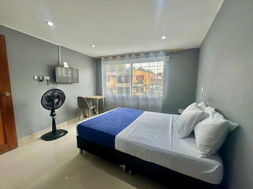 Ένα ή περισσότερα κρεβάτια σε δωμάτιο στο Apartamentos y Loft Laureles