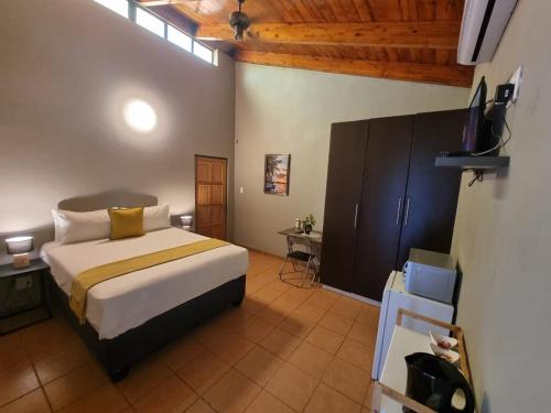 Ένα ή περισσότερα κρεβάτια σε δωμάτιο στο Tee Cee Marvelous Guesthouse
