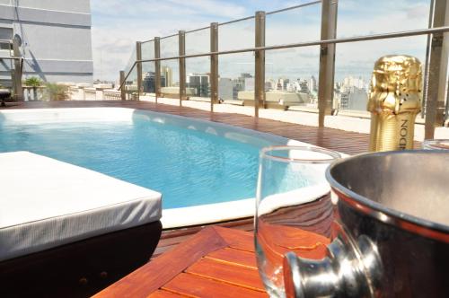 a swimming pool on top of a building at Scala Hotel Buenos Aires in Buenos Aires