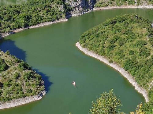 an aerial view of a river with a boat in it at Sunčana strana in Nova Varoš