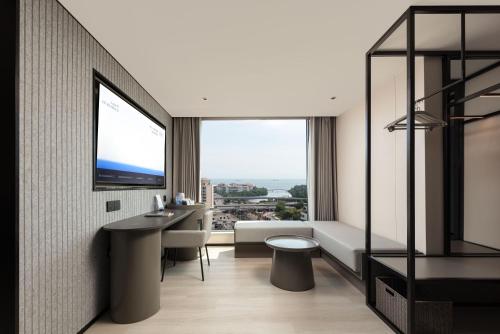 Postel nebo postele na pokoji v ubytování Atour Light Hotel Haikou Guomao Wanlv Garden