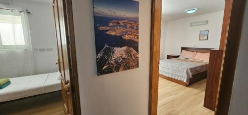 a small room with a bed and a mirror at 3 Floors Villa on Promenade 4 bedrooms 3 bathrooms V1 in Sliema