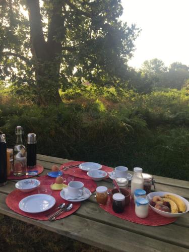 a picnic table with plates of food on it at HAIXPIA in Hasparren