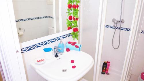 a bathroom with a sink and a shower at Manuela Beach City in Lloret de Mar