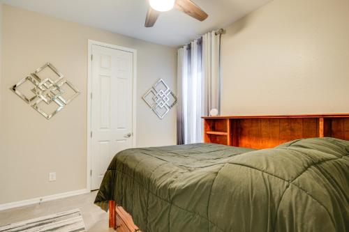 a bedroom with a bed and a white door at Central Casa Grande Home in Quiet Neighborhood in Casa Grande