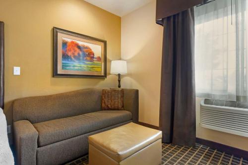 a living room with a couch and a window at Best Western Plus Yakima Hotel in Yakima