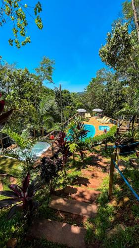 a resort with a water park with a pool at Chalés Senhor Dos Trilhos in Mairiporã