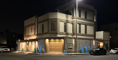 a building with a car parked in front of it at night at شقه مفروشه مميزه 3 in Obhor