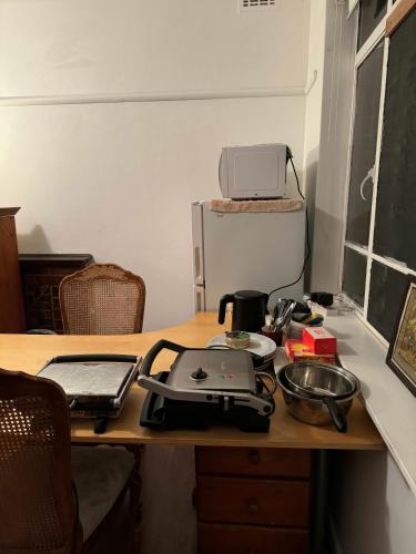 a desk with a computer on top of it at Ashburton big Room with shared bathroom 1 in Chadstone