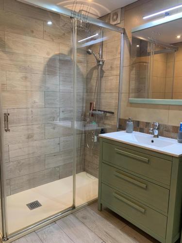 a bathroom with a shower and a sink at Apartamento maspalomas 3 hab stay in gran canaria in Maspalomas
