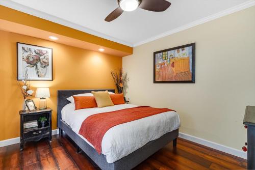 a bedroom with a bed and a ceiling fan at Heart Of Healdsburg A Wine Country Escape in Healdsburg