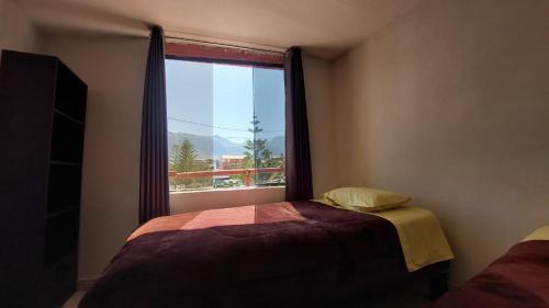 Postel nebo postele na pokoji v ubytování Cabanaconde Backpackers - Plaza de Armas