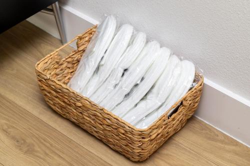 a basket sitting on the floor next to a wall at NEW Lux 5BR Villa Near Disney, Knotts, LA, OC with Hot Tub & Games in Fullerton