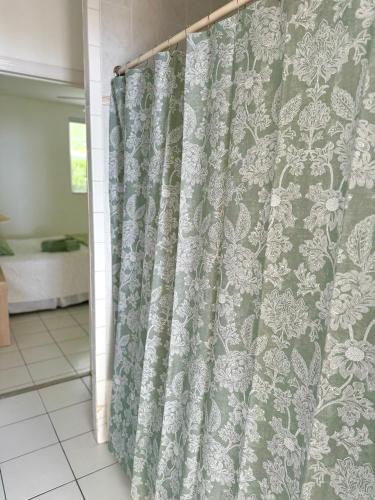 a shower curtain in a room with at Sunset Cove - Vacation In Paradise! in Nassau