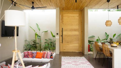 a living room with a couch and a table at El Salao Villas in El Nido