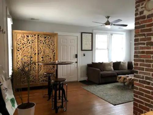 a living room with a couch and a table at Habersham Hideaway in Savannah