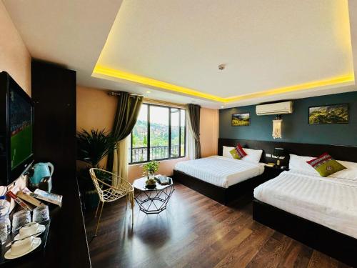 Postel nebo postele na pokoji v ubytování HeLLo Sapa Hotel