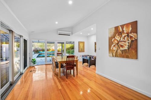 a dining room with a table and chairs at Elegant Luxury - Family Entertainer in Ringwood in Ringwood