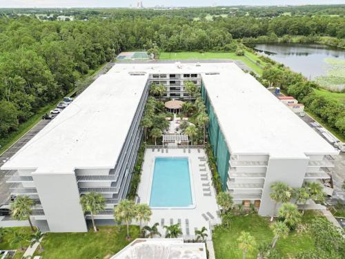 an aerial view of a building with a swimming pool at Elegant 1BR Haven in Orlando & 5 minutes to Disney in Vineland