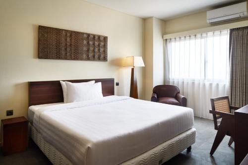 Ein Bett oder Betten in einem Zimmer der Unterkunft ISORAS CIKARANG